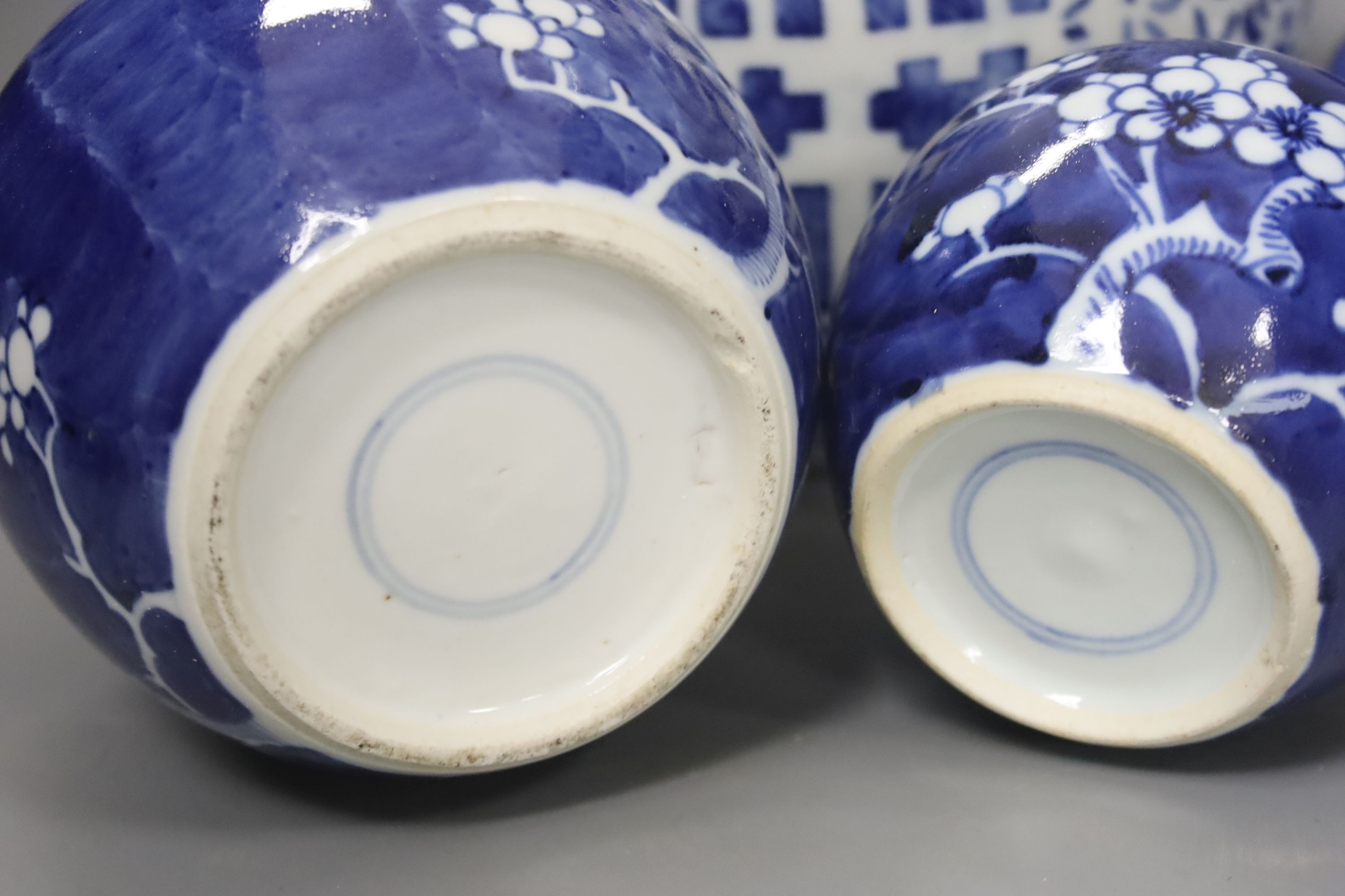 Four Chinese blue and white ginger jars, one with cover, tallest 23cm